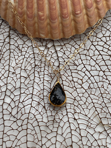 Bermuda black volcanic sand gold teardrop necklace