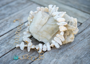 White biwa shape pearls and gold necklace