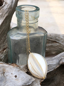 Gold chain and shell pendant necklace