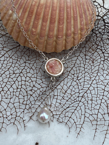Bermuda pink sand necklace with a large silver  bezel and white pearl pendant